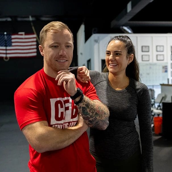 Coach Fay with a member in CFB Athletic Club