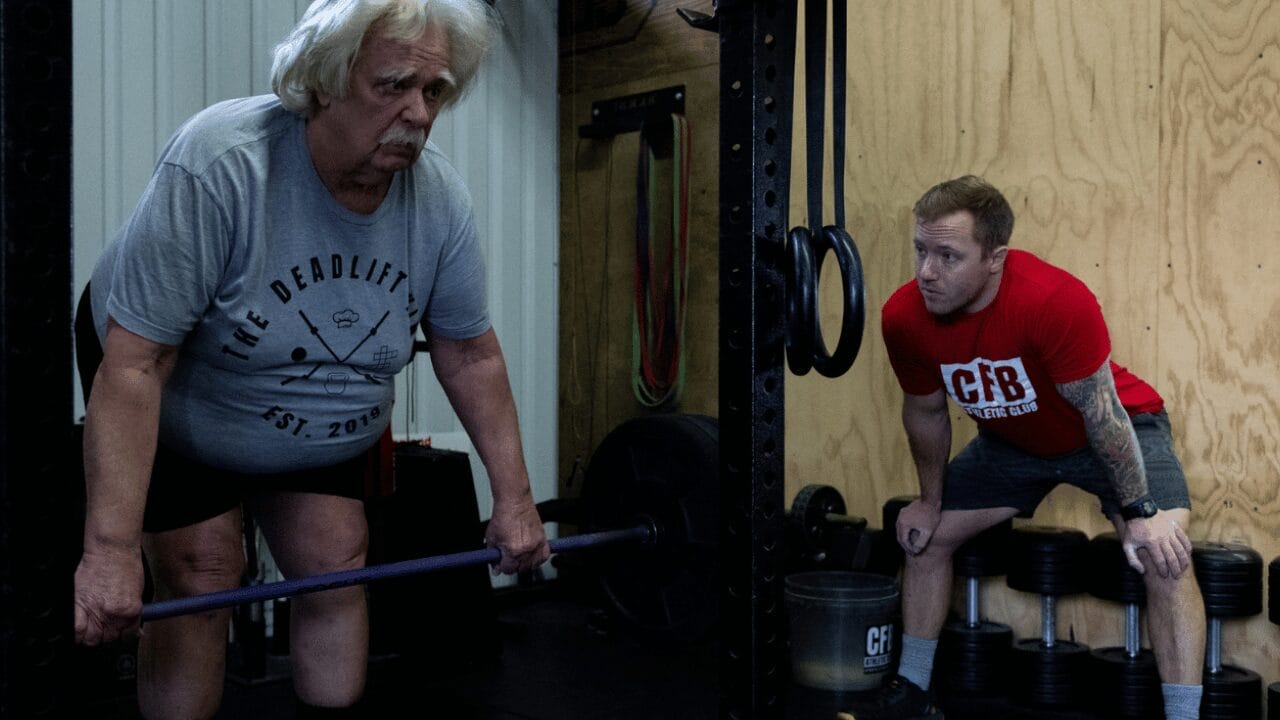 older man with personal trainer